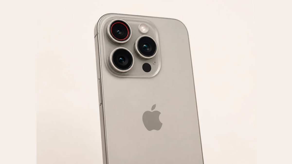 The camera plateau on the back of an iPhone Pro Max with a red aperture ring inside the main lens