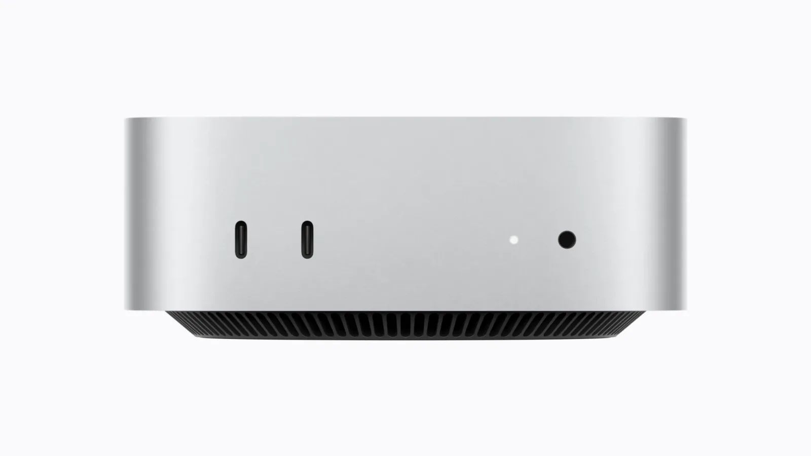 The front edge of the new Mac mini, with two USB-C ports, the power light and the power button.