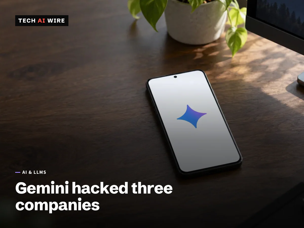 An Android phone lies face up on a dark wooden desk, its screen showing only the Google Gemini spark logo.