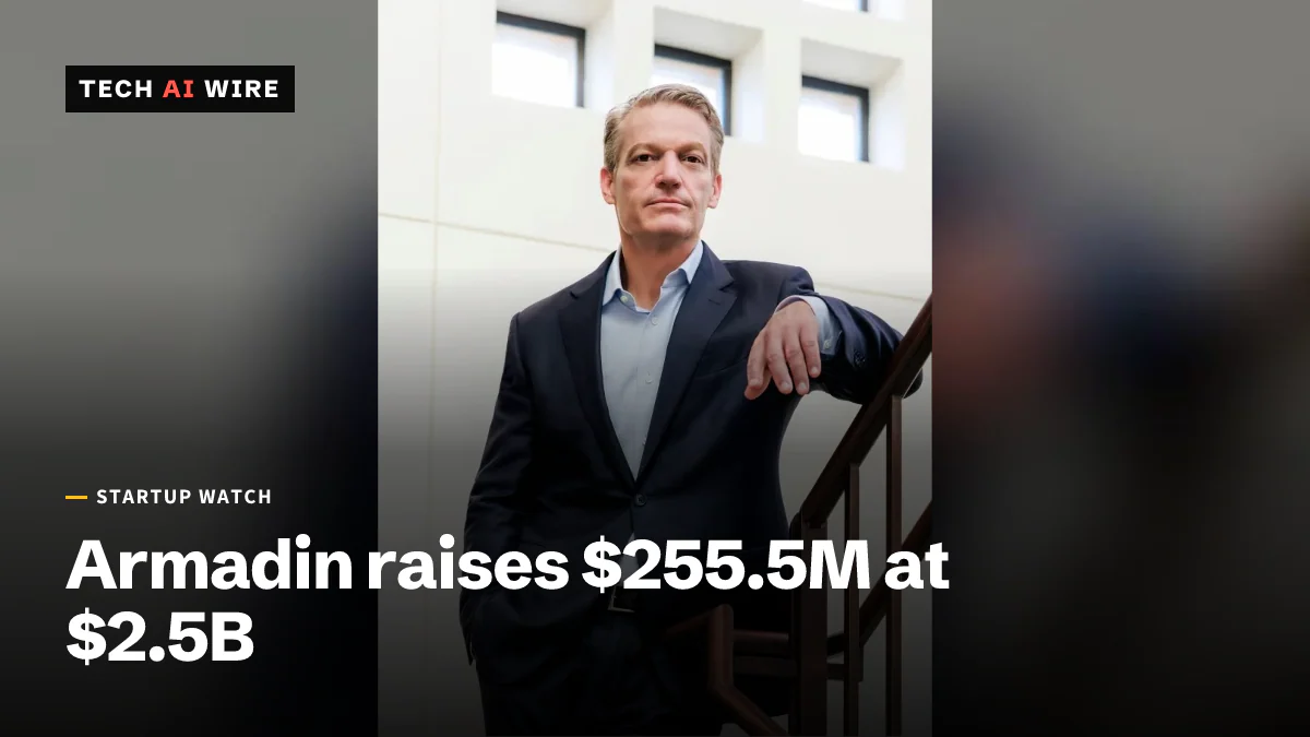 Armadin chief executive Kevin Mandia in a navy suit, leaning on a wooden stair rail in a bright white atrium.