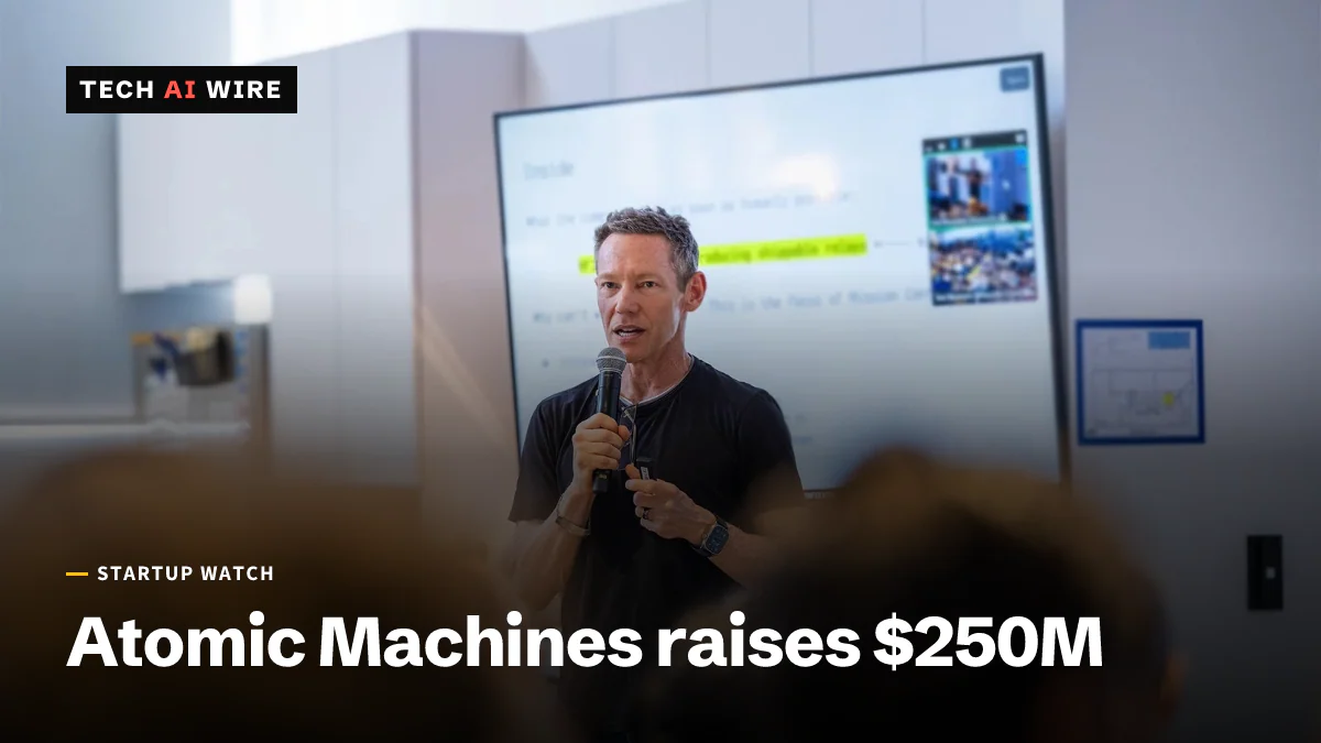 Atomic Machines founder and CEO Jeff Holden speaks into a microphone in front of a presentation screen.