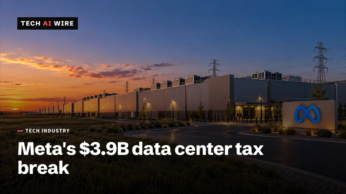A long, low data-center building at sunset, with the blue Meta infinity logo lit on a sign beside the entrance road and power lines behind it.